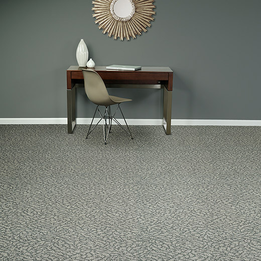 Image of a desk on patterned commercial carpet for the commercial flooring page